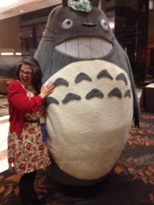 Unstaged reaction to hugging Totoro. Photo by Remy Nakamura.